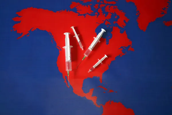 Map with syringes and needles — Stock Photo, Image