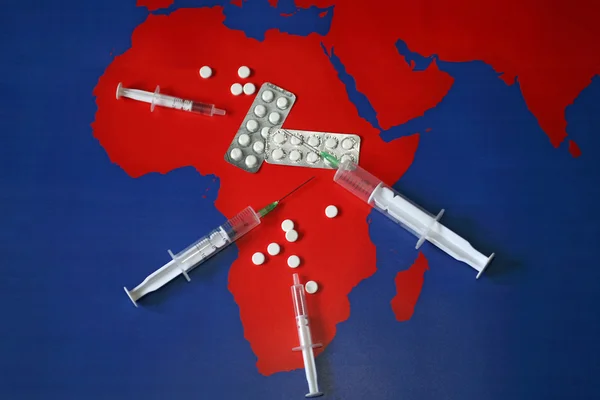Map with tabletes, syringes and needles — Stock Photo, Image