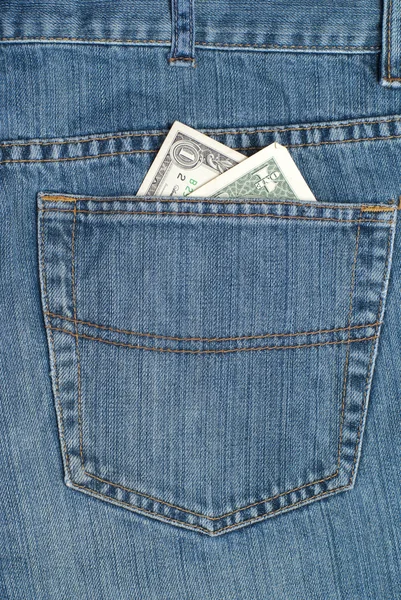 stock image Blue jeans with one dollar