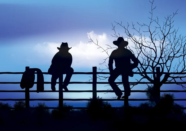 坐在栅栏上的两个牛仔 — 图库照片