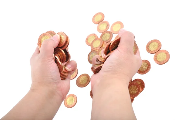 Dvě ruce drží mince — Stock fotografie