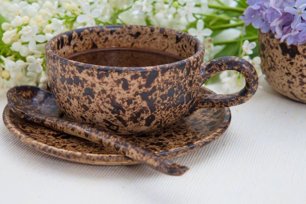Ceramic cup and lilac — Stock Photo, Image