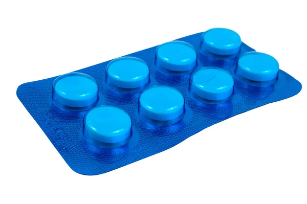 Pilules dans l'emballage bleu foncé — Photo