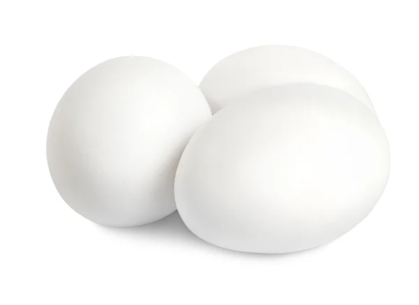 Три білих яєць — стокове фото