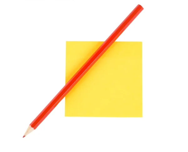 Red pencil on paper isolated — Stock Photo, Image