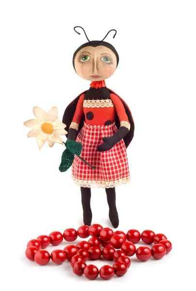 Soft toy ladybird and chaplet — Stock Photo, Image