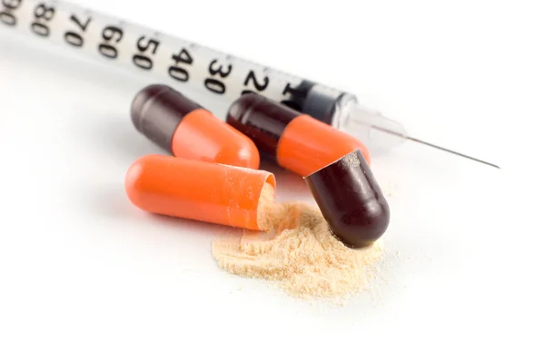 Capsule and syringe — Stock Photo, Image