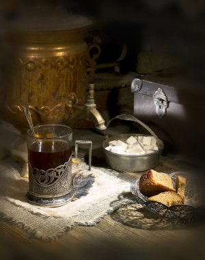 Old samovar on the table with tea and sugar clipart