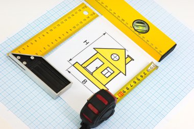 evde arka plan grafik kağıt üzerinde inşaat araçlarıyla çizim