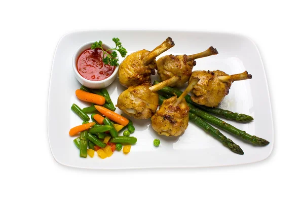 Chicken legs with asparagus and ketchup — Stock Photo, Image