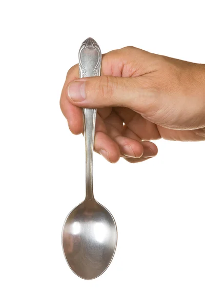 Stock image spoon in hand isolated on white background
