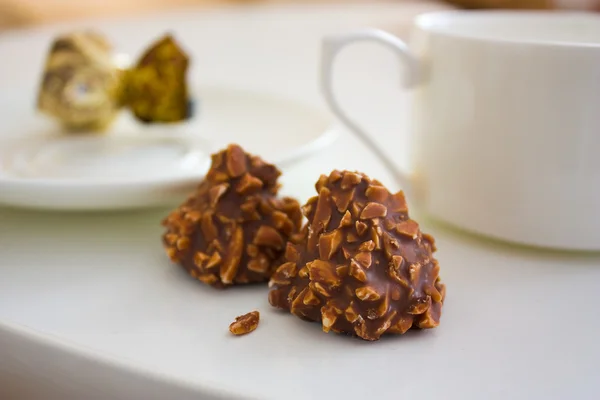 stock image chocolate candy with nuts and tea