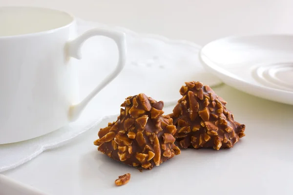 stock image Chocolate candy with nuts and tea