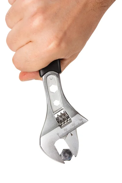 Skiftnyckel med skruv i handen — Stockfoto