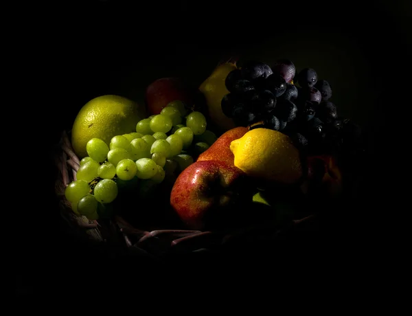 Still life with fruit in a basket — Stock Photo, Image