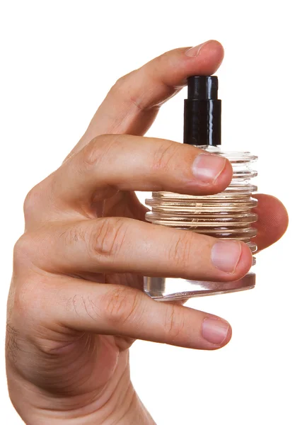 Bottle of cologne in his hand — Stock Photo, Image