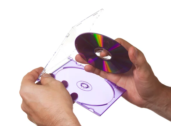 CD-ROM kutusunun içinde el — Stok fotoğraf