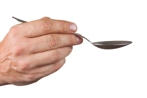Spoon in hand — Stock Photo, Image