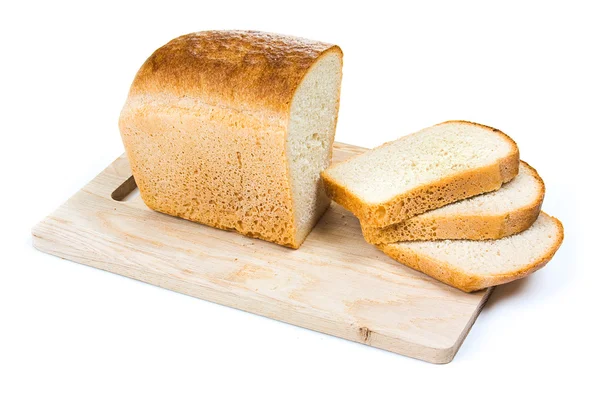 Bröd på en skärbräda — Stockfoto