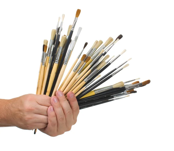 Brushes in hand — Stock Photo, Image