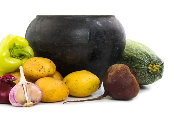 stock image Cast iron pot and vegetables