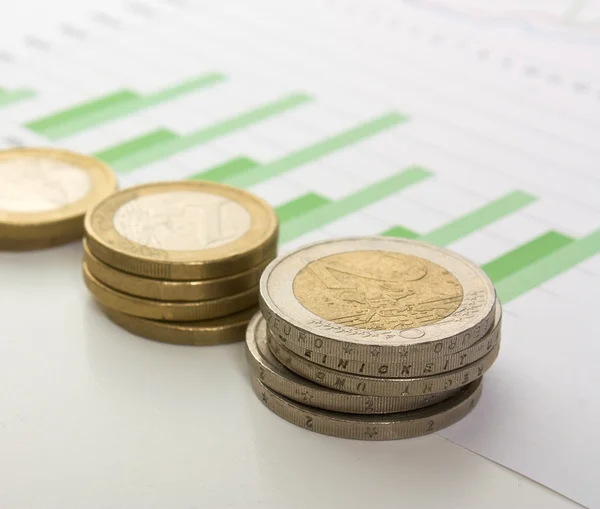 Charts and coins — Stock Photo, Image