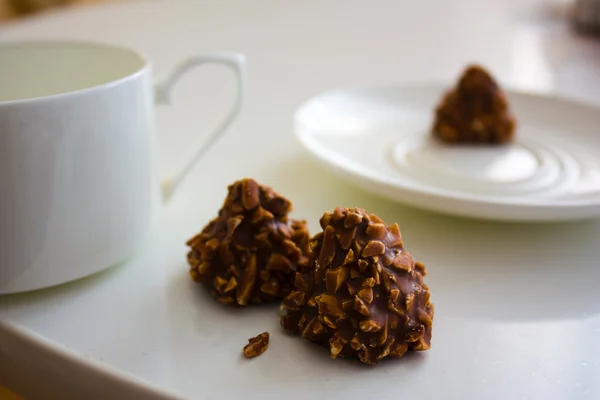 stock image Chocolate candy with nuts and tea