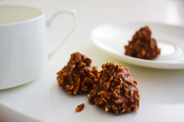 stock image Chocolate candy with nuts and tea