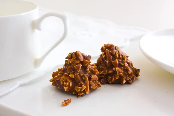 Stock image Chocolate candy with nuts and tea