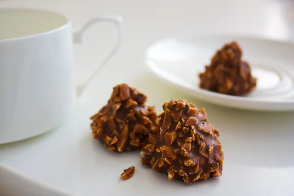 stock image Chocolate candy with nuts and tea