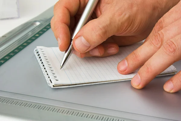 Write with a pen in a notebook — Stock Photo, Image