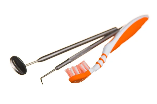 Zahnbürste und zahnärztliche Instrumente — Stockfoto