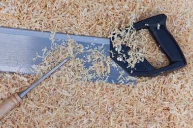 Wood shavings handsaw and chisel clipart