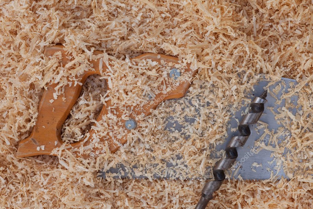 Wood shavings handsaw and drill bit — Stock Photo © PiLens 2835292