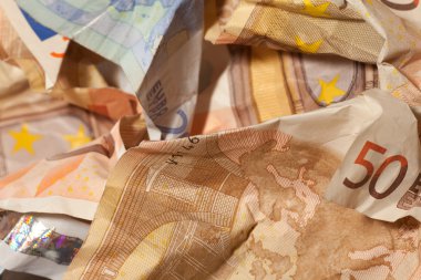 Crinkled euro bills closeup clipart
