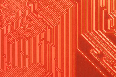 Closeup of computer circuit board in orange clipart