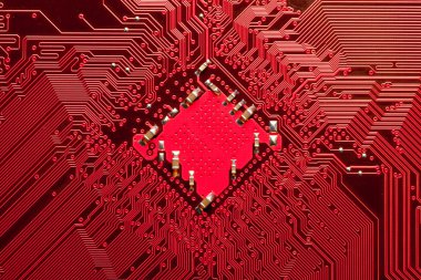 Closeup of computer circuit board in red clipart