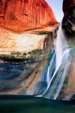 Waterfall in Utah's red rock country clipart