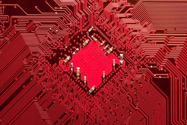 Closeup of computer circuit board in red — Stock Photo, Image