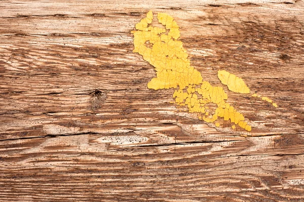 Placa de tinta amarela em madeira — Fotografia de Stock
