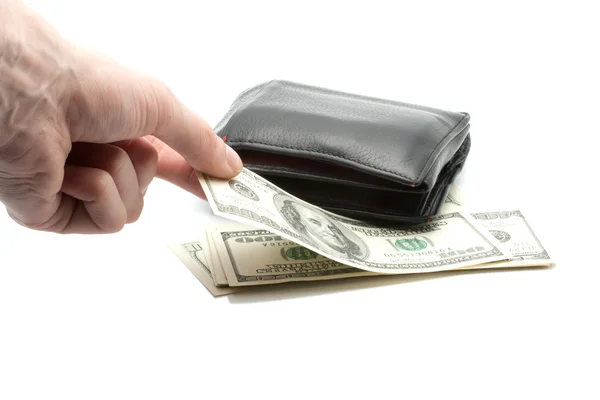 Бумажник с долларами и рукой — стоковое фото