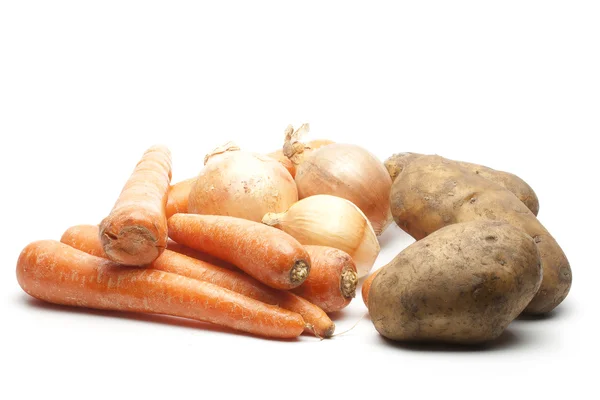 Stock image Heap of carrots onions and potatoes