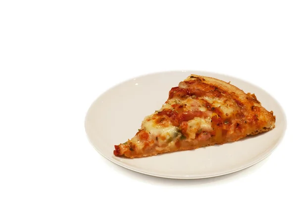 Piece of tasty pizza on plate — Stock Photo, Image