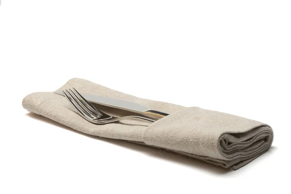 Faca e garfo em guardanapo têxtil — Fotografia de Stock
