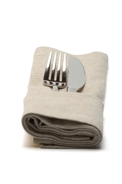 Cuchillo y tenedor en servilleta textil —  Fotos de Stock