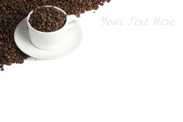 White coffee mug on beans — Stock Photo, Image