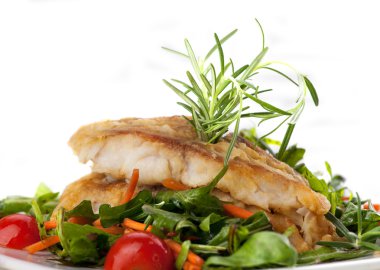 Fillet of white fish and vegetables clipart