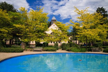 Holy church with pool at front side clipart