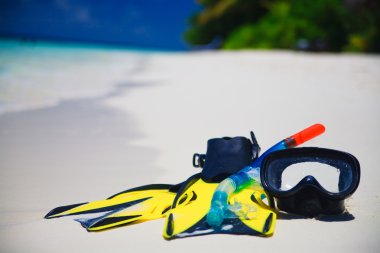 Diving Mask with fins on beach clipart