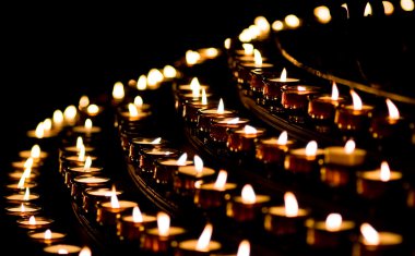 Candle light in a church clipart